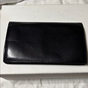 Genuine smooth Leather Black large wallet. Preowned but never used.Made in Japan
